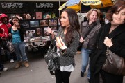 Adrienne Bailon - Eating a hot dog in Times Square, NY - 4/08/2009